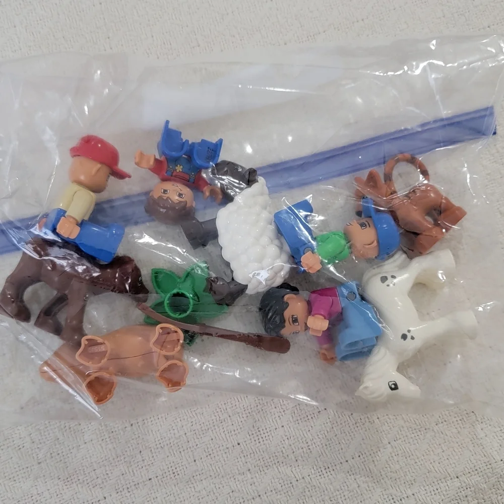 Lego Farmers set with 10 figures, including a farmer, farmer's wife, and 2 kids,